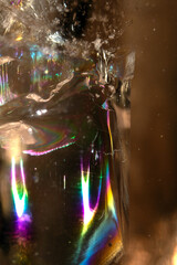 Beautiful close up of quartz crystal rock shard with reflective rainbow spiritual light