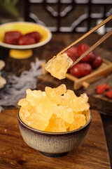 Handmade yellow rock sugar cubes from ancient Yunnan displayed with traditional elements and ingredients