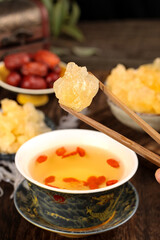 Discover handmade ancient yellow rock candy with sugar cane pieces paired with herbal tea in a tranquil setting