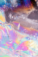 Beautiful close up of quartz crystal rock shard with reflective rainbow spiritual light