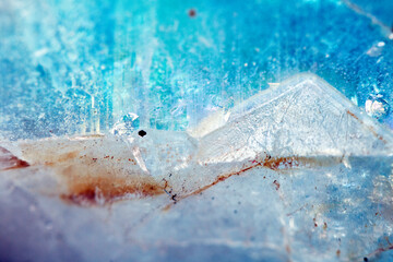 Beautiful close up of quartz crystal rock shard with reflective rainbow spiritual light