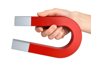 A hand holding a red horseshoe magnet, showcasing its distinct shape and metallic ends.