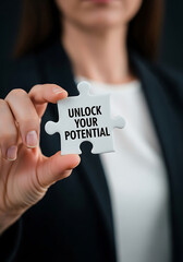 Woman Holding Unlock Your Potential Puzzle Piece hand