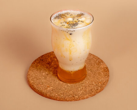 Assortment of Delicious Frappes and Milkshakes on Plain Background