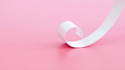 A single sheet of white paper curves into a smooth wave shape against a soft pastel pink background