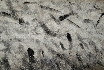 Abstract wall art with black and gray stains on white surface, Hand thumbprints on white canvas