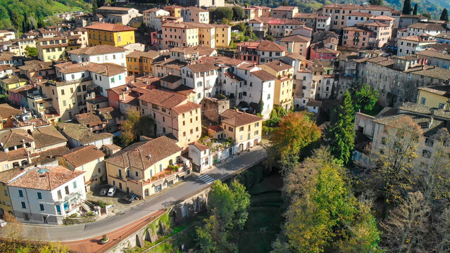 Beautiful aerial view of Barga, nestled in the Garfagnana valley, bathed in sunlight