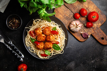 Spaghetti and Meatballs Dish with Fresh Tomatoes and Basil