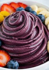 Closeup of Swirled Purple Acai Bowl with Fresh Berries and Banana