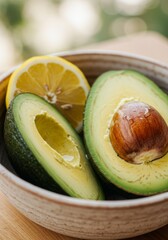 Halved Avocados and Lemon Slice in Bowl