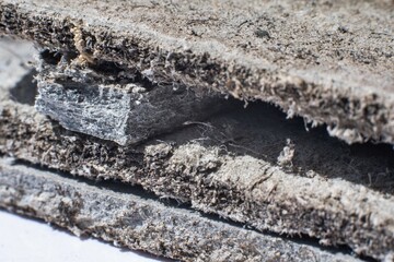 Detailed photography of building  material with asbestos fibres. Health harmful and hazards effects.