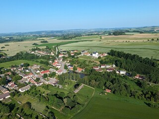 Fototapeta premium Priseka village and historic castle museum aerial panorama in Czech countryside