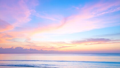 Fototapeta premium Soft-focus seascape at sunrise/sunset, pastel hues dominate the sky and ocean