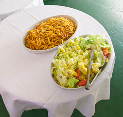 Picture of Close up Fried French Fries and salad in a white plate