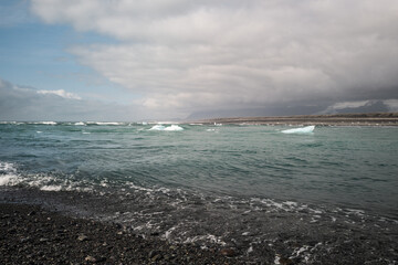 Dramatic Cloudy Sky Over Rocky Arctic Shoreline