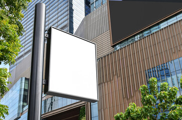 Black outdoor pole vertical billboard with mock up white screen. Clipping path for mockup
