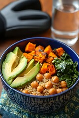 Colorful Buddha Bowl with Quinoa Chickpeas Roasted Sweet Potato Avocado and Spinach