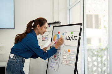 UX and UI Designer Presenting Ideas in Team Meeting