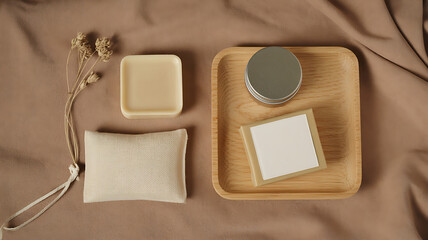 Still life of natural soap, cosmetic products, and dried flowers on a wooden tray