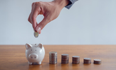 Women put coins in piggy banks ,Money saving and deposit for investment to get profit and dividend concept.
