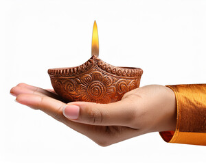 Indian Festival Diwali, lamp in hand, Traditional indian woman’s hands with colorful bangles holding lit Diwali oil lamp for festival of lights

