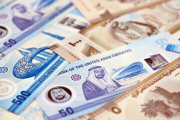 United Arab Emirates dirham currency money bills. The current banknotes lies on table in big amount
