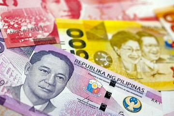 Philippines peso currency money bills. The current banknotes lies on table in big amount