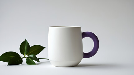 White ceramic mug with purple loop handle beside green leaves on white background white mug purple handle