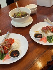 steamed rice topped with chicken On the table