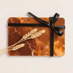 Gift box with ribbon and bow alongside chocolate bar and present package on white background