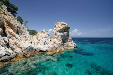 Beautiful landscape with rocky shore of the beach on the Mediterranean Sea in Greece, Travel concept.