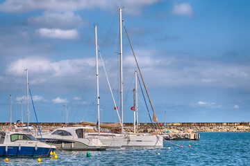 Pier with boats on the shore of the Black Sea in Sile