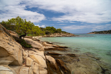 Beautiful landscape with rocky shore of the beach on the Mediterranean Sea in Greece, Travel concept.