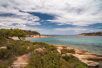 Naklejka premium Beautiful landscape with rocky shore of the beach on the Mediterranean Sea in Greece, Travel concept.