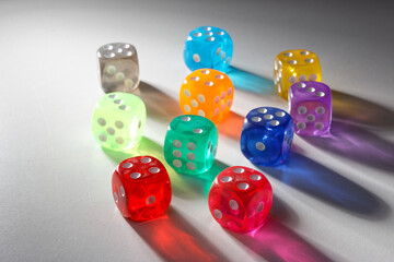 A random arrangement of multicolored dice, captured after the dices have been cast.