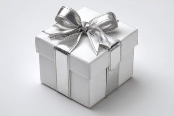 Elegant white gift box with silver ribbon sits on a plain background, perfect for special occasions and celebrations