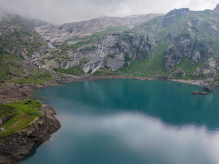 Drone view at dam and lake Zott near Robiei in the Swiss alps