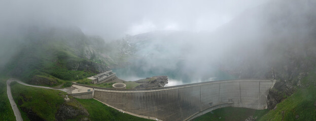 Drone view at dam and lake Zott near Robiei in the Swiss alps