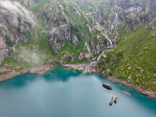 Drone view at dam and lake Zott near Robiei in the Swiss alps