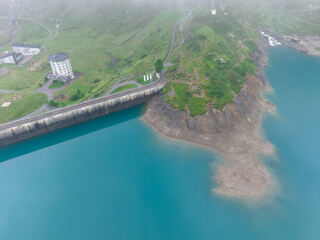 Drone view at dam and lake Robiei in the Swiss alps