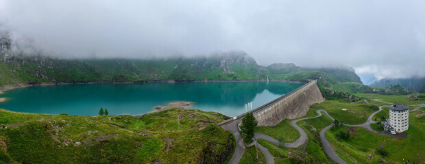 Drone view at dam and lake Robiei in the Swiss alps