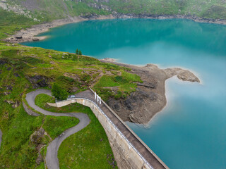 Drone view at dam and lake Robiei in the Swiss alps