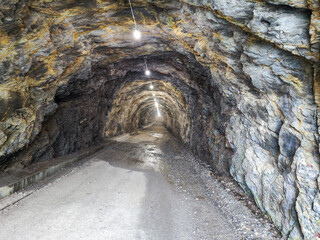 Tunnel on the way to lake Zott near Robiei in the Swiss alps