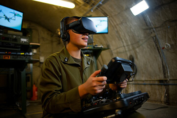 Woman soldier operating drone via remote control in high-tech bunker, wearing headset, with surveillance screens in background