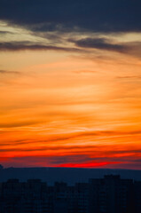 Colourful sunset gradient over city buildings