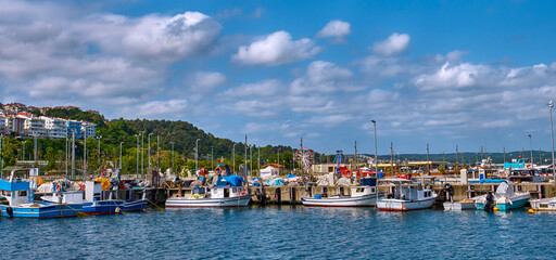 Pier with boats on the shore of the Black Sea in Sile