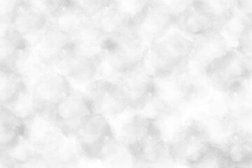 Abstract background of soft, blurred white and light grey watercolor texture.