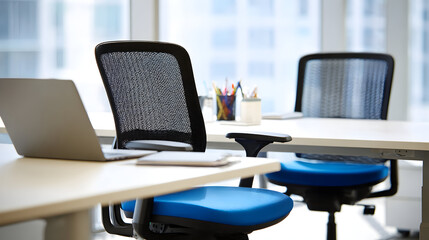 Modern office workspace with stylish ergonomic chairs and laptop, perfect for startups, innovative businesses, and creative teams ready to work