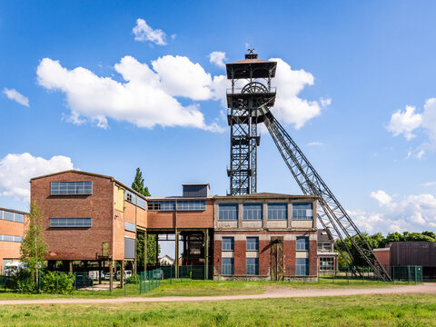 Loos-en-Gohelle, France - May 11, 2025: Pithead and headframe of the former pit no. 11 of the Compagnie des mines de Lens coal mining company, converted into a sustainable development center.