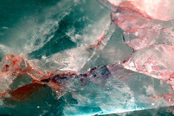 Beautiful close up of quartz crystal rock shard with reflective rainbow spiritual light